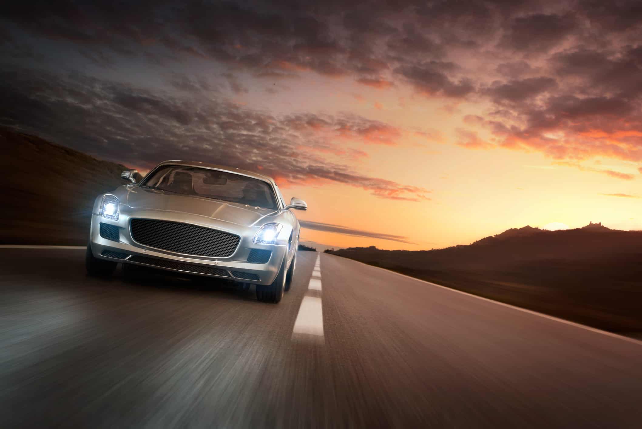 Luxury sports car at the sunset - automotive industry